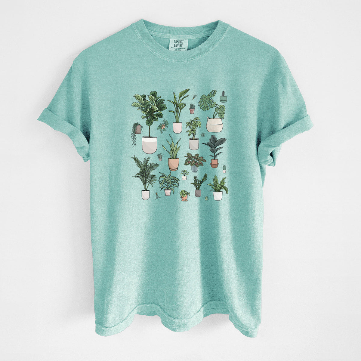 Chalky mint Comfort Colors t-shirt laid flat, printed with a full-color collection of potted houseplants in different pots.