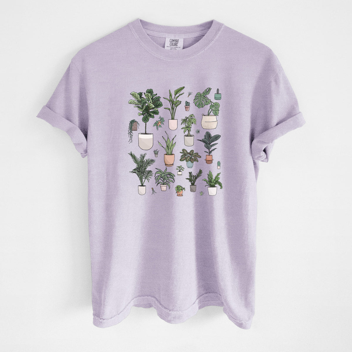 Orchid purple Comfort Colors t-shirt laid flat, printed with a full-color collection of potted houseplants in different pots.