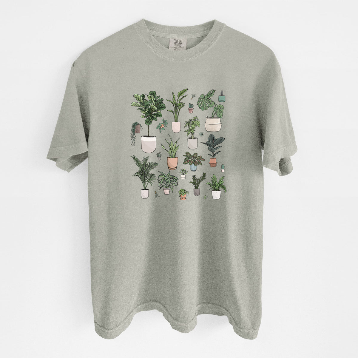 Sandstone beige Comfort Colors t-shirt laid flat, printed with a full-color collection of potted houseplants in different pots.