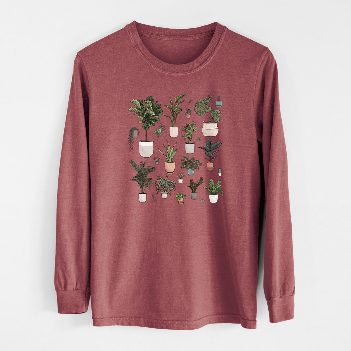 Brick red Comfort Colors long sleeve shirt laid flat, printed with a full-color collection of potted houseplants in different pots.