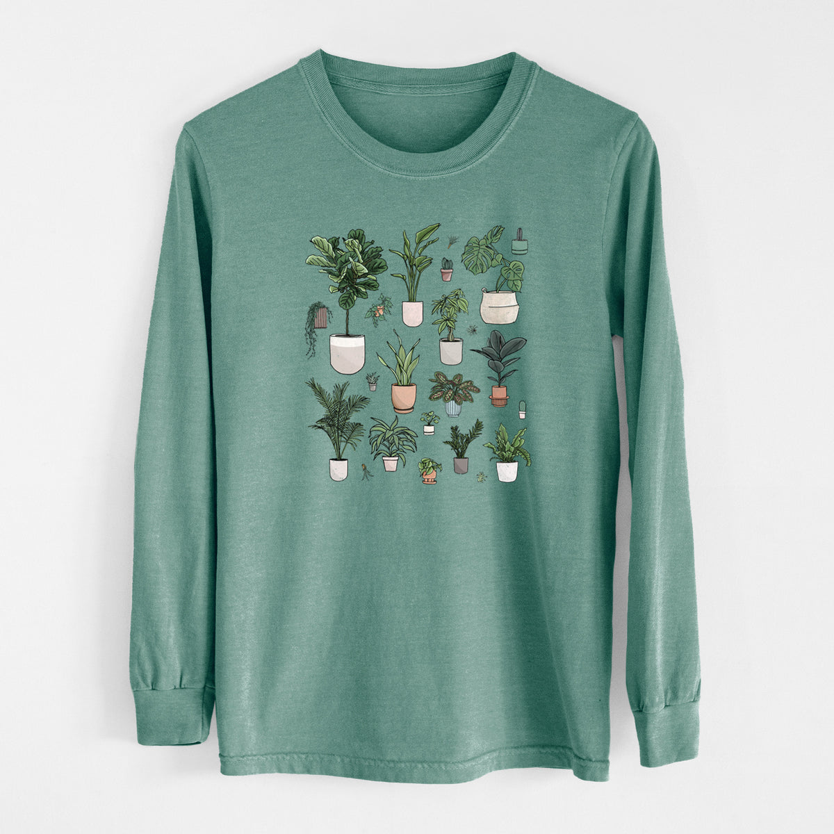 Pine green Comfort Colors long sleeve shirt laid flat, printed with a full-color collection of potted houseplants in different pots.
