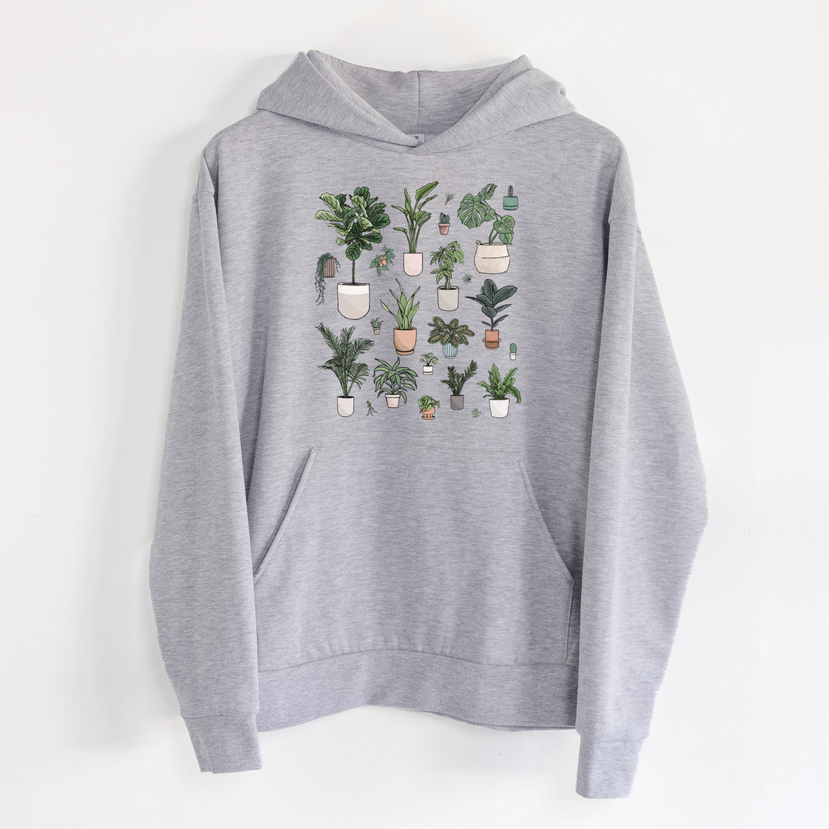 Collection of Houseplants - Statement Midweight Hoodie in Heather Grey, hanging on a white wall, with a front kangaroo pocket and no drawcords.