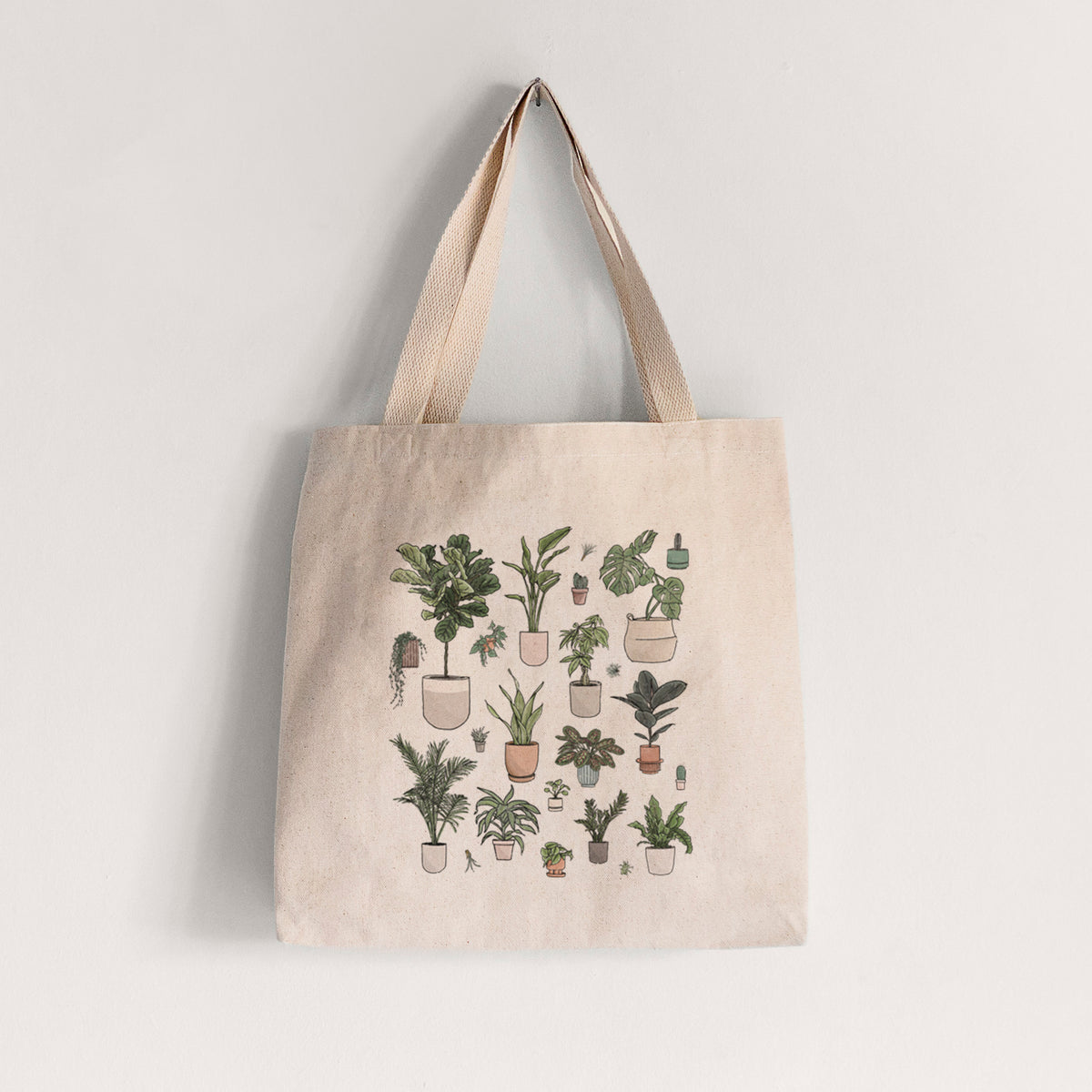 Natural canvas tote bag printed with a full-color collection of potted houseplants in different pots.
