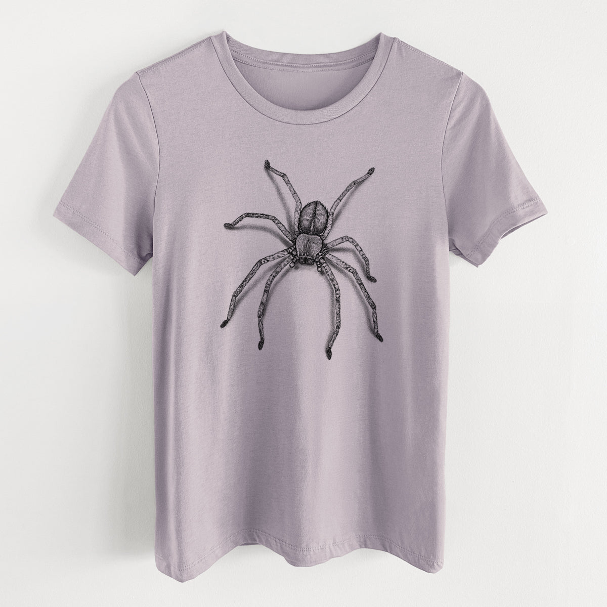 Light violet women's relaxed fit cotton t-shirt laid flat, printed with a detailed black ink illustration of a huntsman spider with long legs spread.