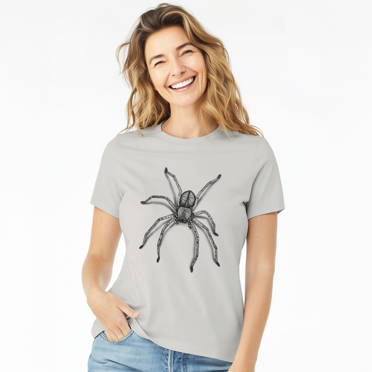 Woman wearing a lunar grey women's relaxed fit cotton t-shirt printed with a detailed black ink illustration of a huntsman spider with long legs spread.