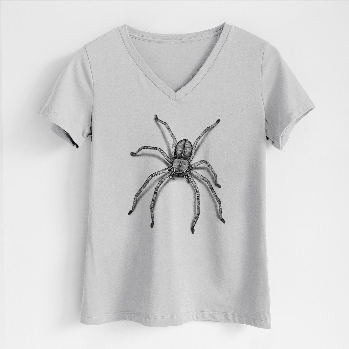 Lunar grey women's relaxed fit cotton V-neck t-shirt laid flat, printed with a detailed black ink illustration of a huntsman spider with long legs spread.