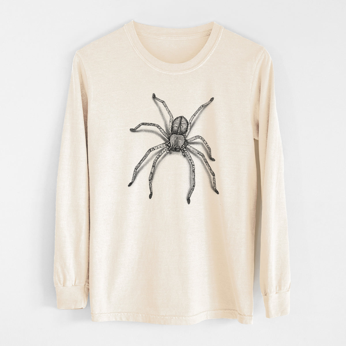 Ivory Comfort Colors long sleeve shirt laid flat, printed with a detailed black ink illustration of a huntsman spider with long legs spread.