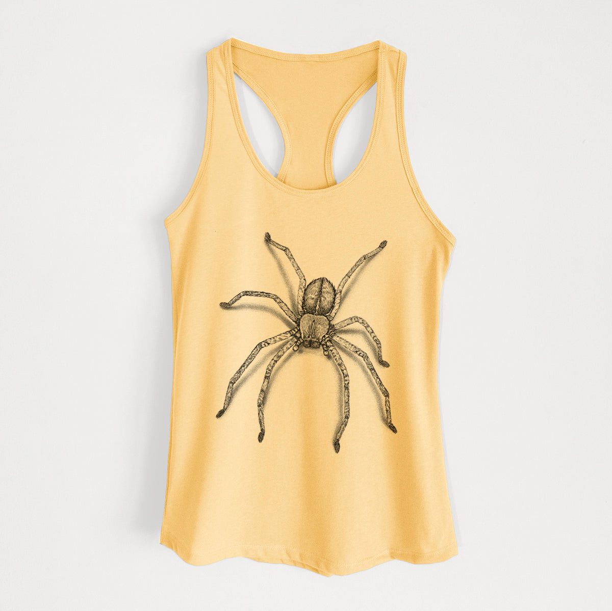 Banana cream women's racerback tank top laid flat, printed with a detailed black ink illustration of a huntsman spider with long legs spread.