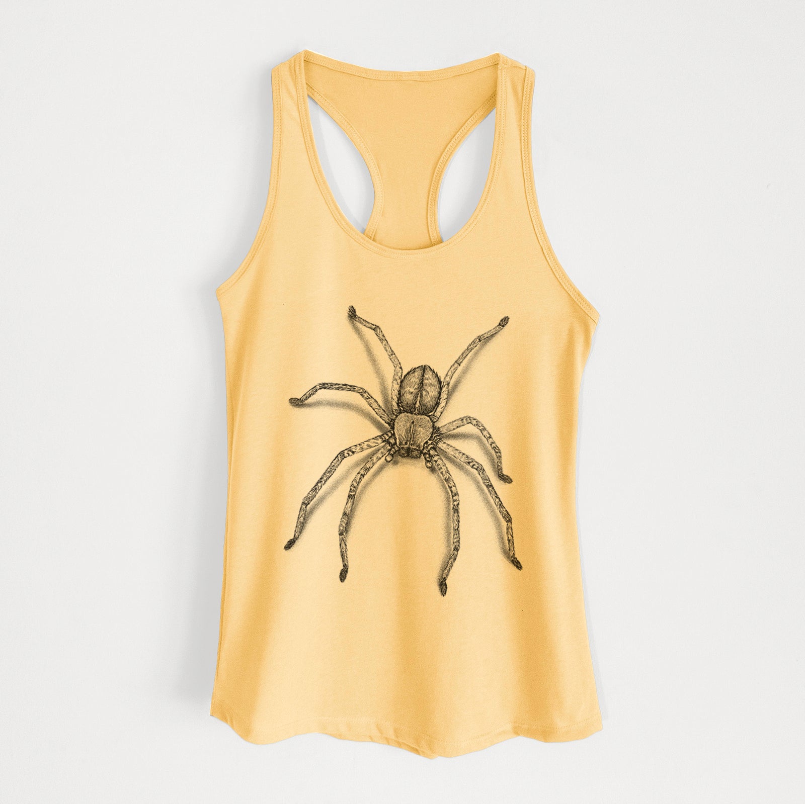 Banana cream women's racerback tank top laid flat, printed with a detailed black ink illustration of a huntsman spider with long legs spread.