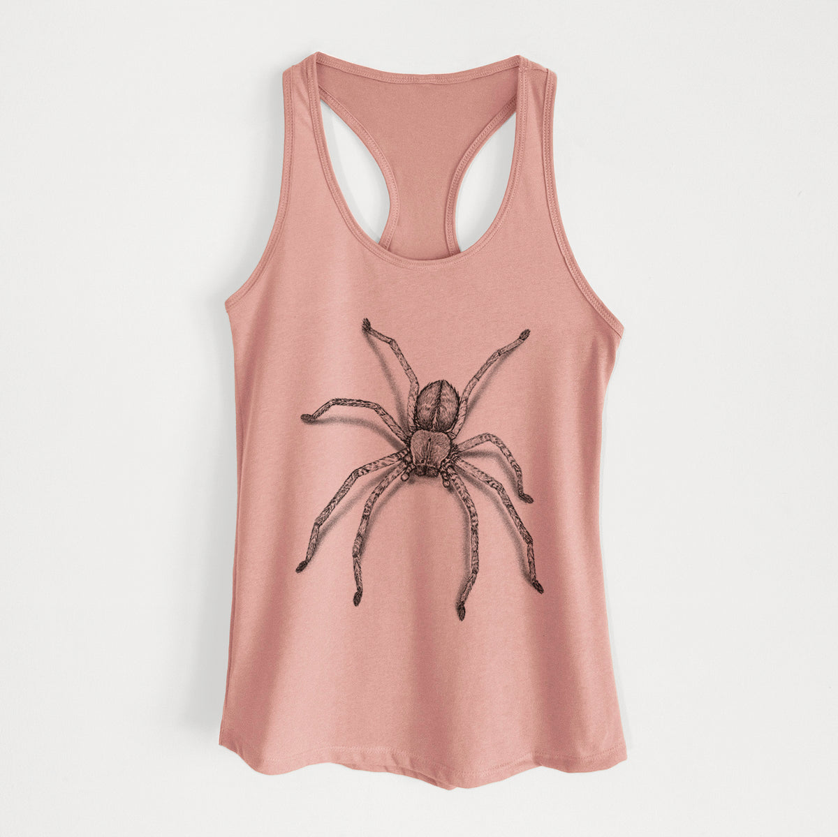 Desert pink women's racerback tank top laid flat, printed with a detailed black ink illustration of a huntsman spider with long legs spread.