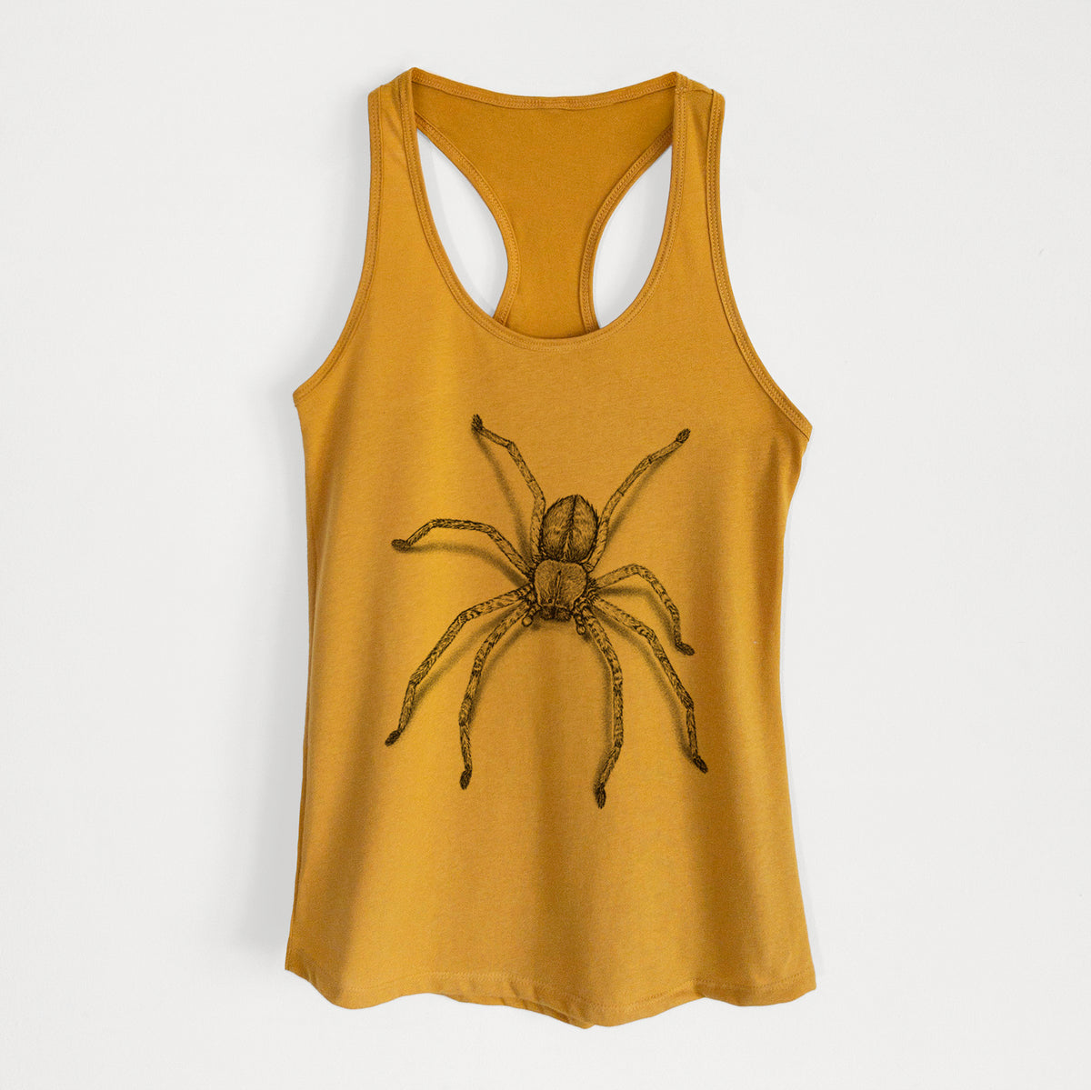 Gold women's racerback tank top laid flat, printed with a detailed black ink illustration of a huntsman spider with long legs spread.