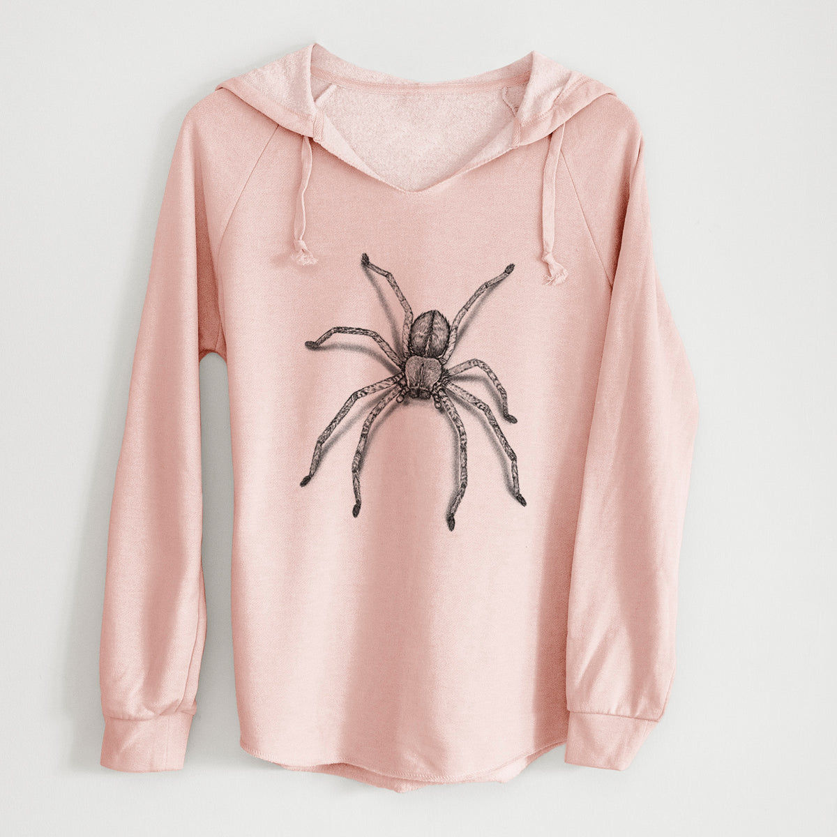 Blush pink women's Cali Wave hooded sweatshirt laid flat, printed with a detailed black ink illustration of a huntsman spider with long legs spread.