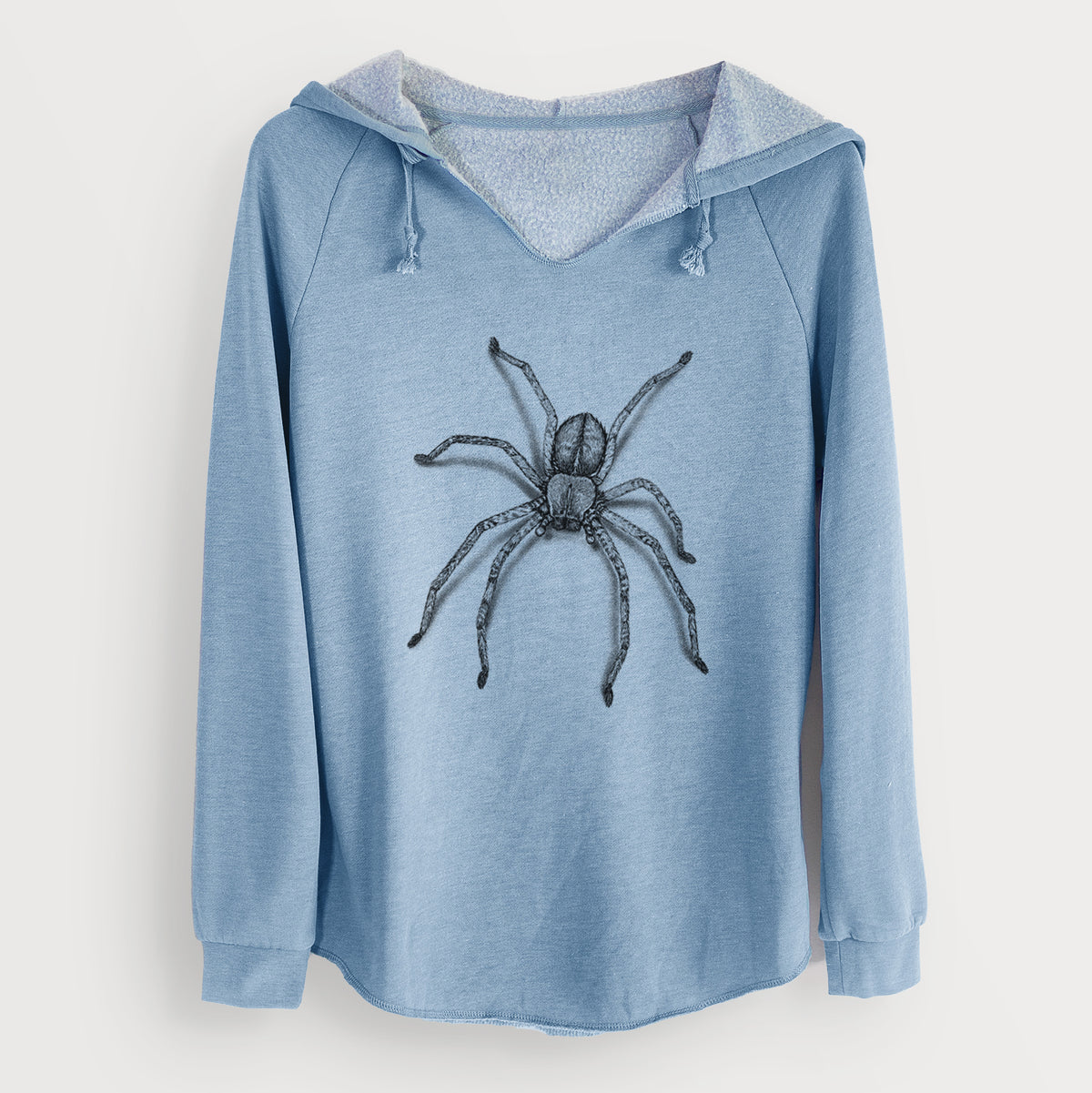 Misty blue women's Cali Wave hooded sweatshirt laid flat, printed with a detailed black ink illustration of a huntsman spider with long legs spread.