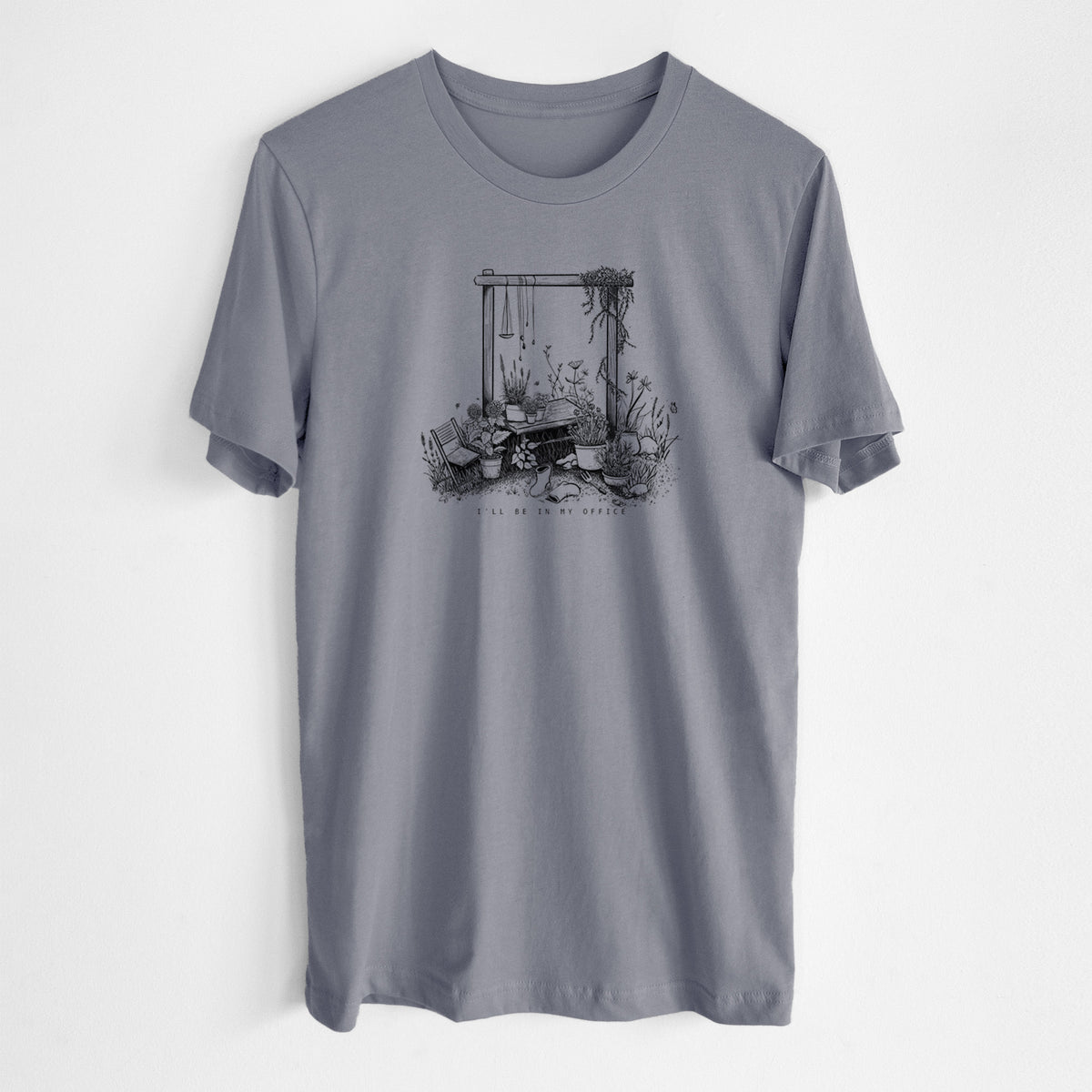 Storm grey lightweight cotton t-shirt laid flat, printed with a black ink illustration of a garden gate arch surrounded by potted plants and flowers.