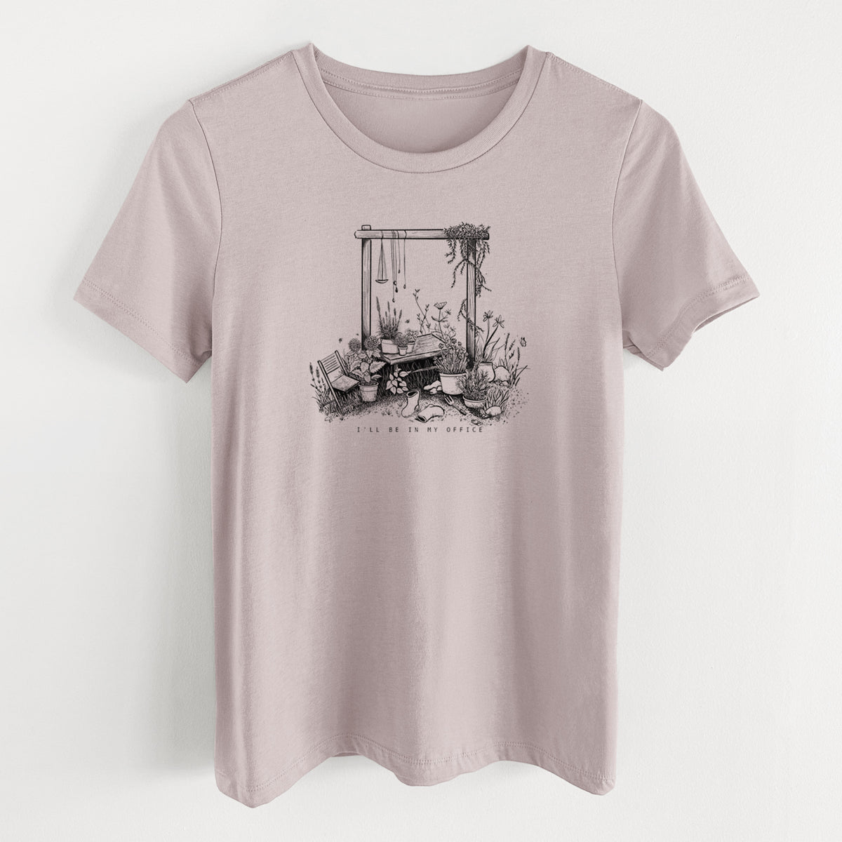 Pink gravel women's relaxed fit cotton t-shirt laid flat, printed with a black ink illustration of a garden gate arch surrounded by potted plants and flowers.