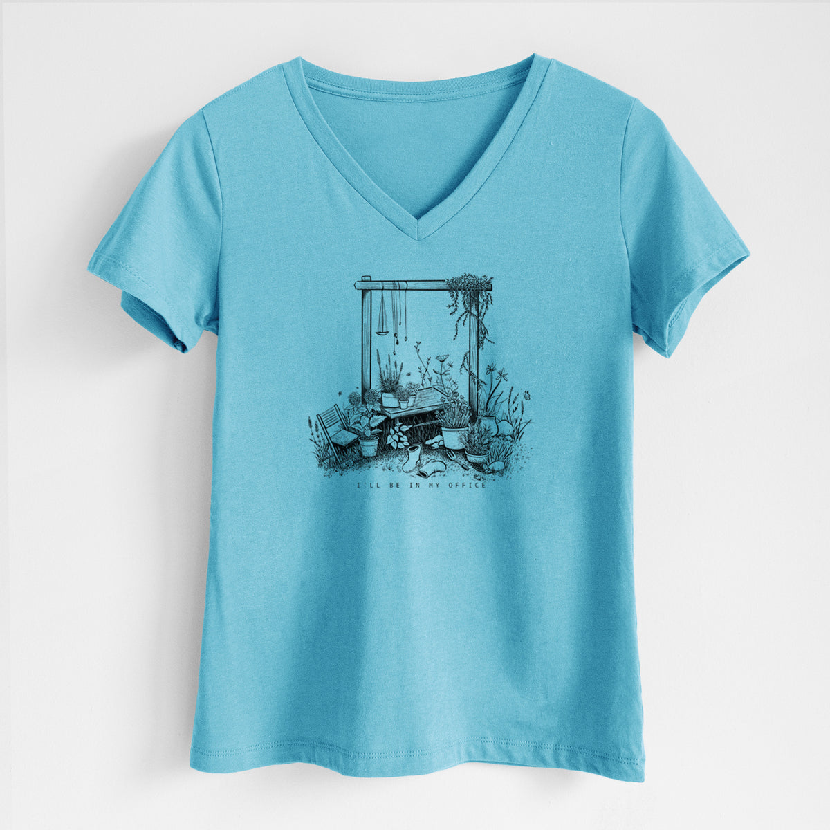 Turquoise women's relaxed fit cotton V-neck t-shirt laid flat, printed with a black ink illustration of a garden gate arch surrounded by potted plants and flowers.