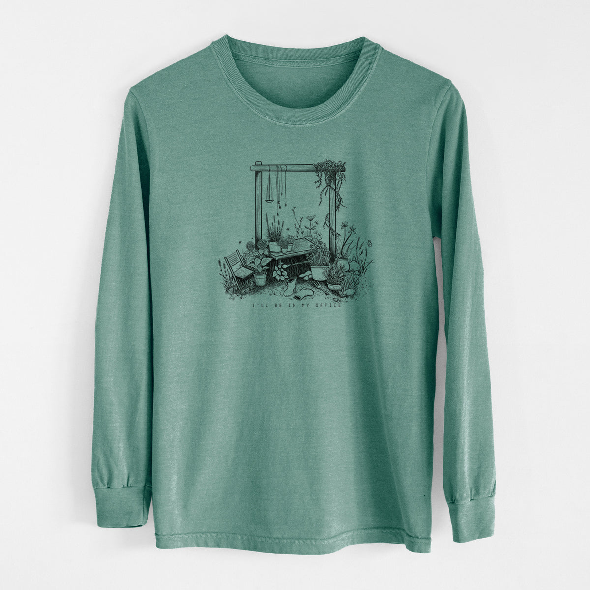 Pine green Comfort Colors long sleeve shirt laid flat, printed with a black ink illustration of a garden gate arch surrounded by potted plants and flowers.