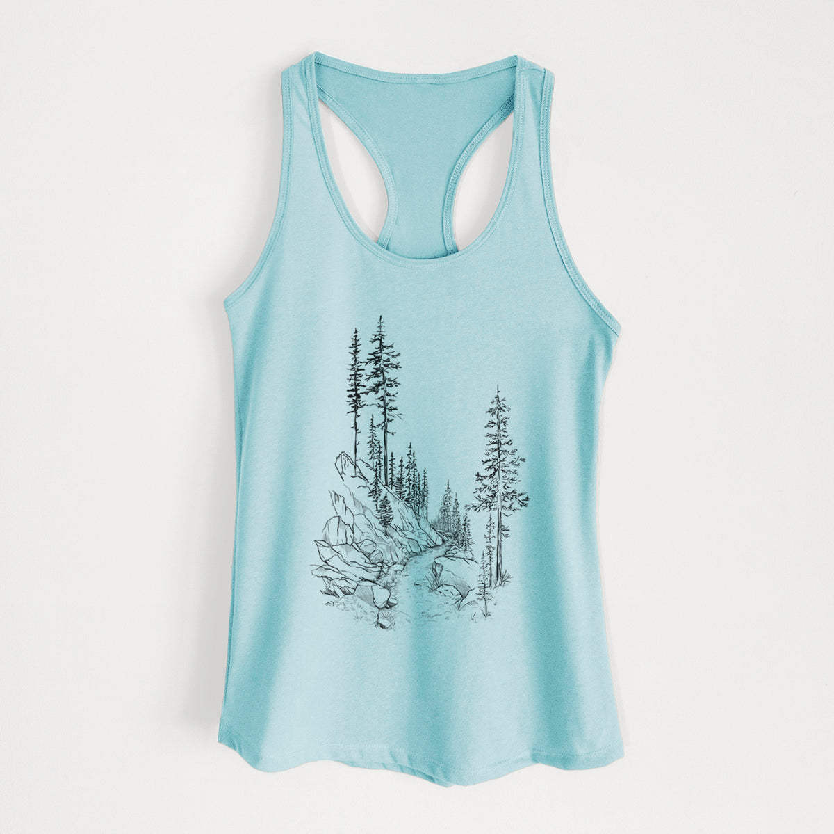 Cancun blue women's racerback tank top laid flat, printed with a black ink illustration of a trail winding past tall pine trees and rocks into the woods.