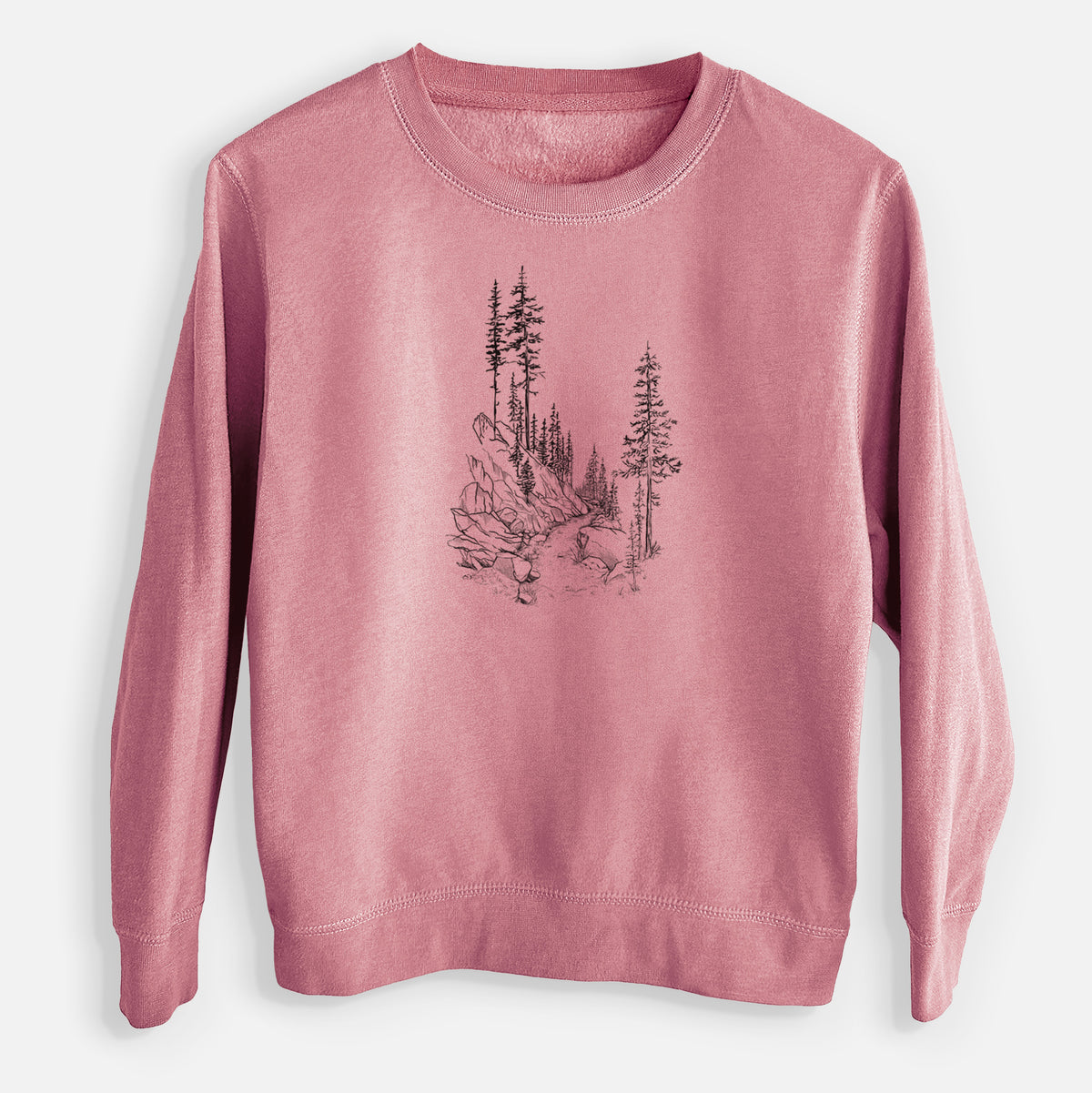 Mauve pink youth crewneck sweatshirt laid flat, printed with a black ink illustration of a trail winding past tall pine trees and rocks into the woods.