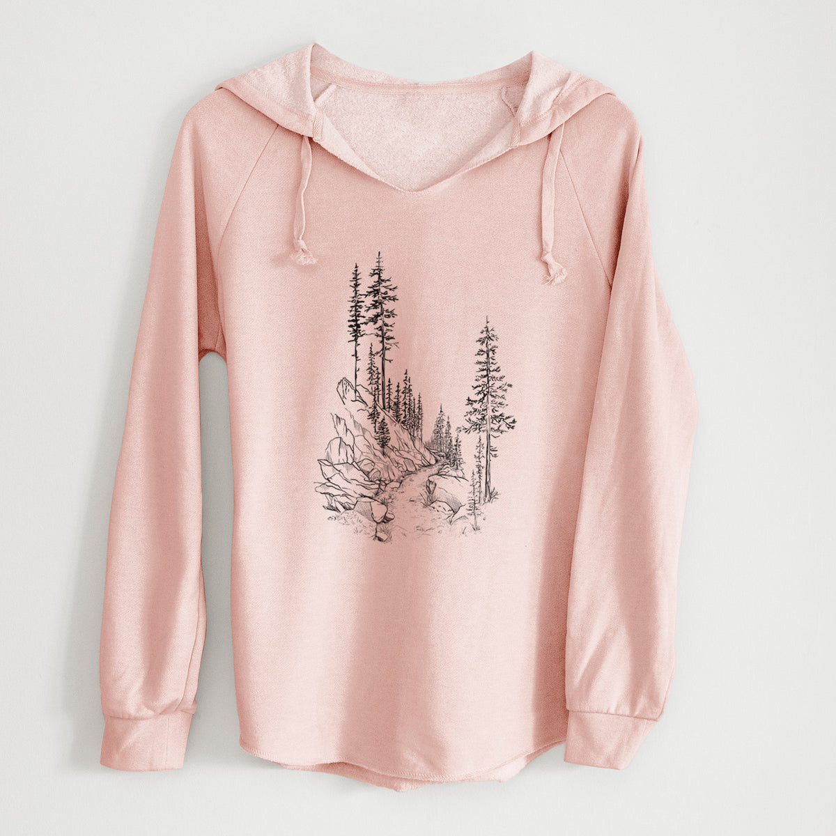 Blush pink women's Cali Wave hooded sweatshirt laid flat, printed with a black ink illustration of a trail winding past tall pine trees and rocks into the woods.
