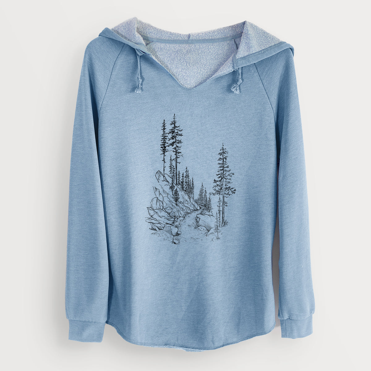 Misty blue women's Cali Wave hooded sweatshirt laid flat, printed with a black ink illustration of a trail winding past tall pine trees and rocks into the woods.