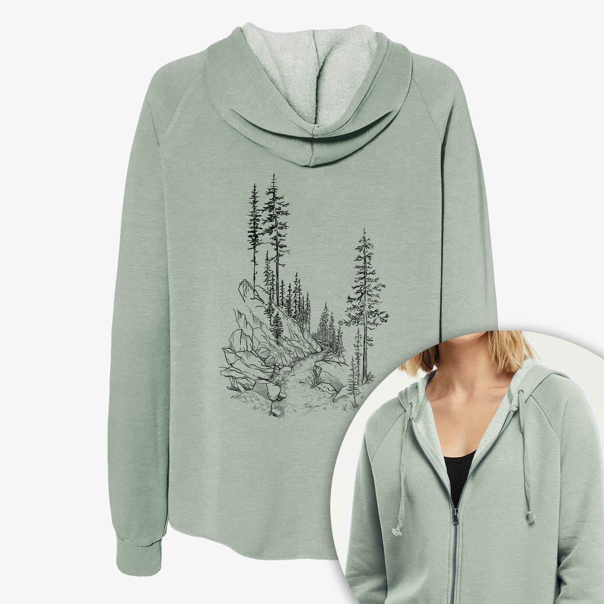 Women's Cali Wave zip-up sweatshirt printed with a black ink illustration of a trail winding past tall pine trees and rocks into the woods, with a close-up of the zipper.