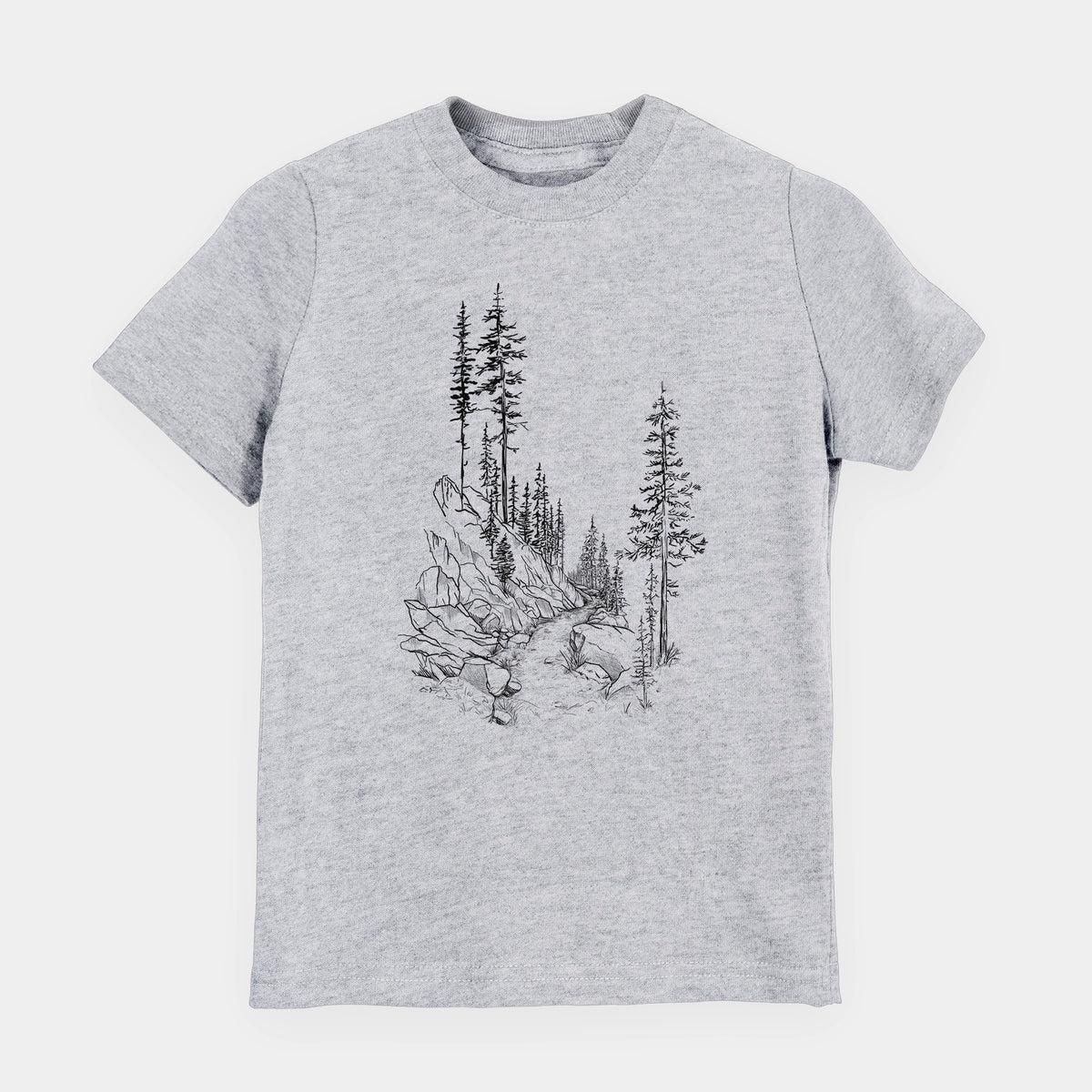 Heather grey youth t-shirt laid flat, printed with a black ink illustration of a trail winding past tall pine trees and rocks into the woods.
