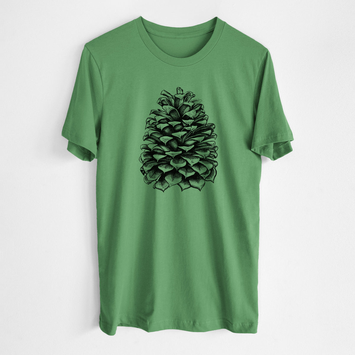 Leaf green lightweight cotton t-shirt laid flat, printed with a detailed black ink illustration of a large Jeffrey pine cone.