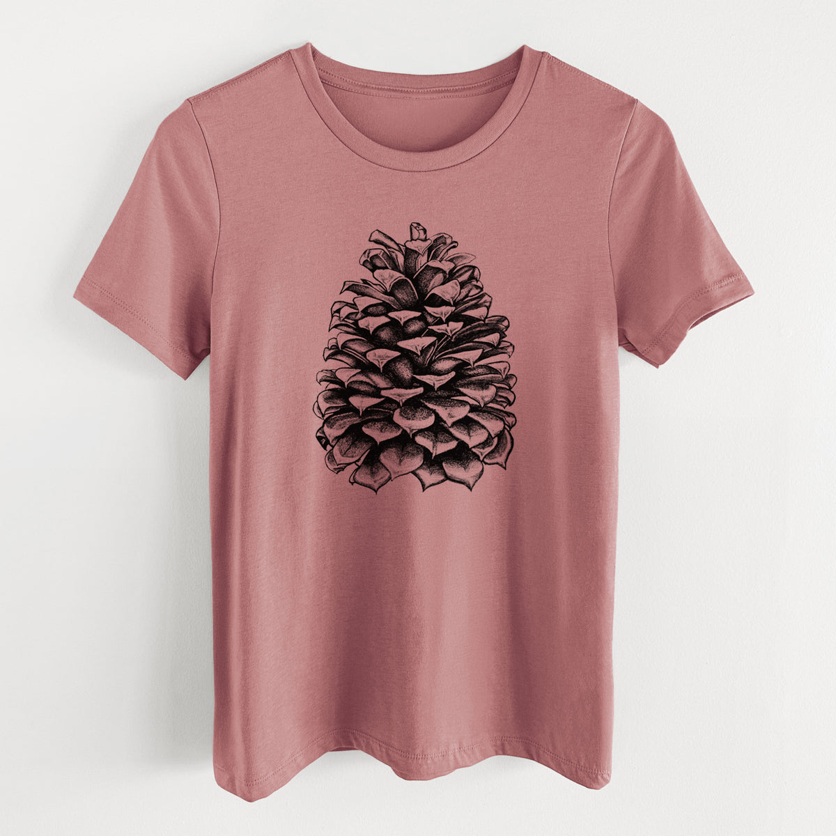 Mauve pink women's relaxed fit cotton t-shirt laid flat, printed with a detailed black ink illustration of a large Jeffrey pine cone.