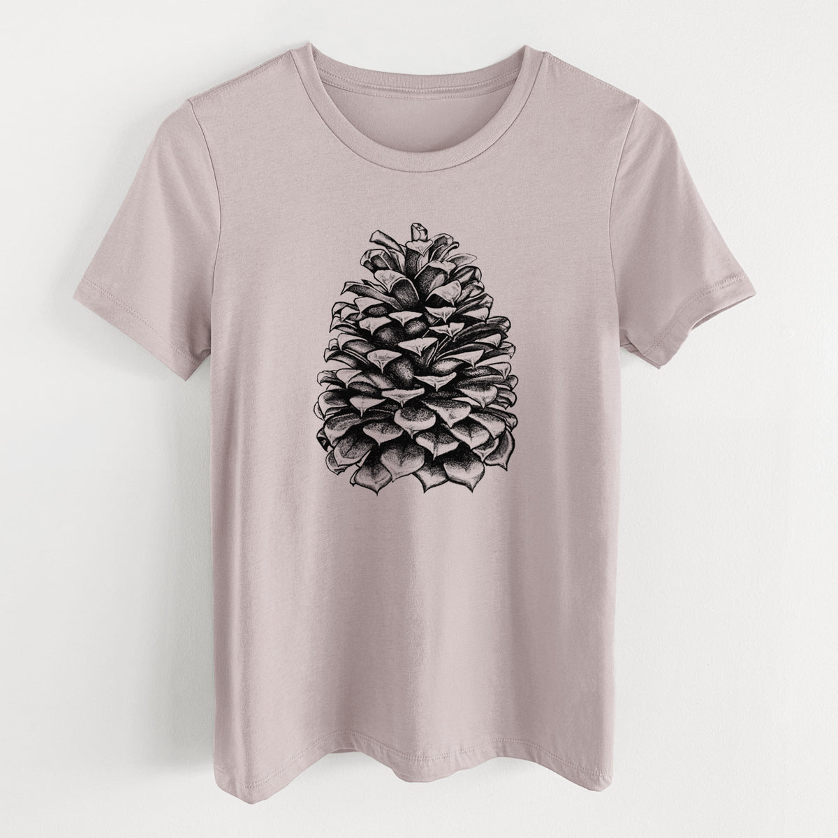 Pink gravel women's relaxed fit cotton t-shirt laid flat, printed with a detailed black ink illustration of a large Jeffrey pine cone.