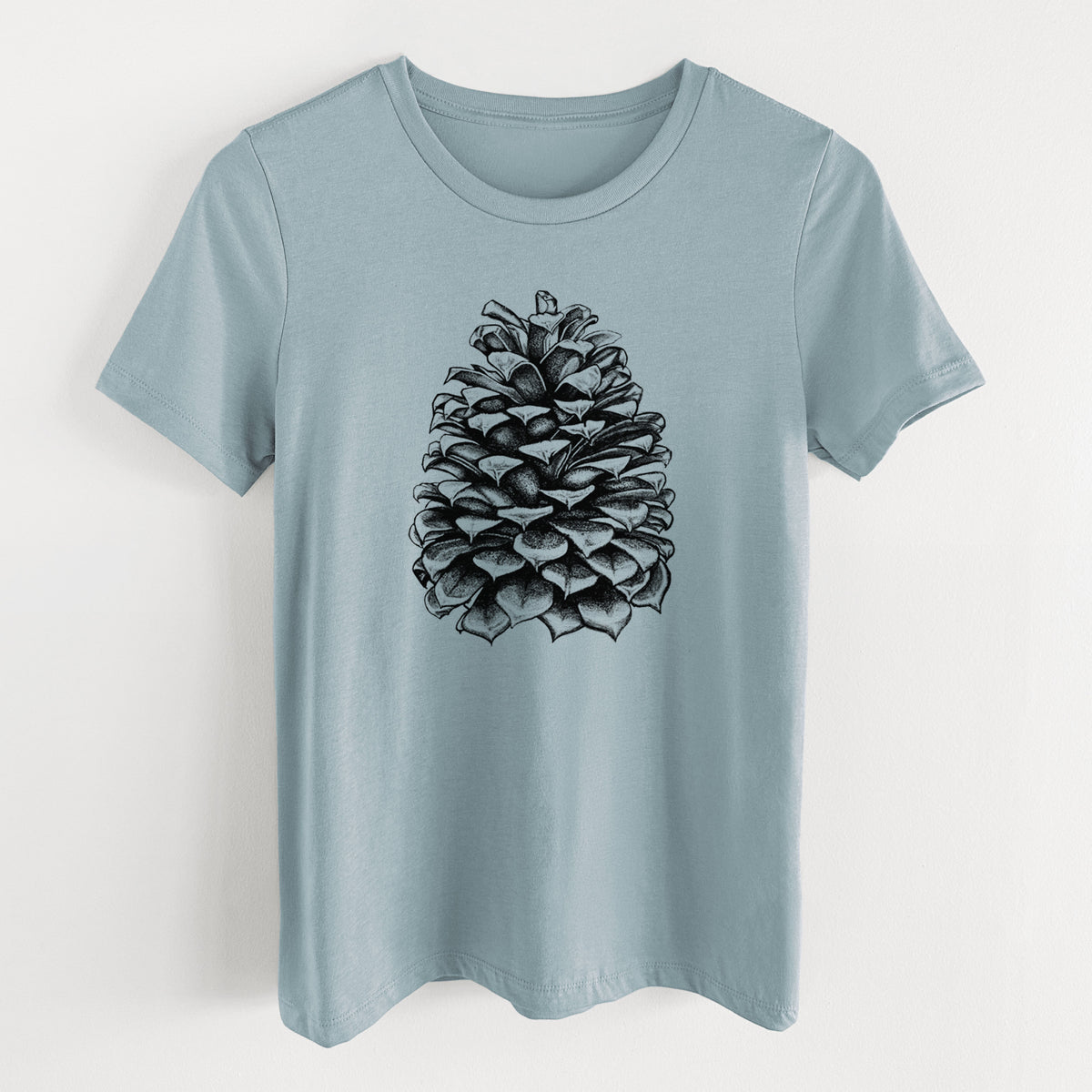 Vintage denim women's relaxed fit cotton t-shirt laid flat, printed with a detailed black ink illustration of a large Jeffrey pine cone.