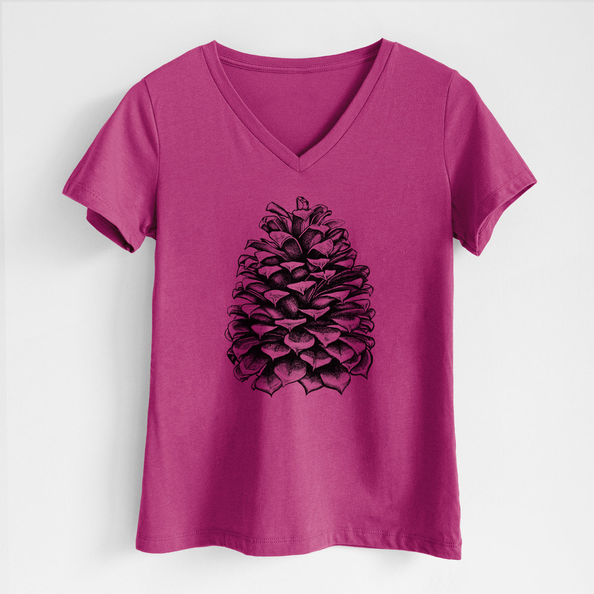 Berry pink women's relaxed fit cotton V-neck t-shirt laid flat, printed with a detailed black ink illustration of a large Jeffrey pine cone.