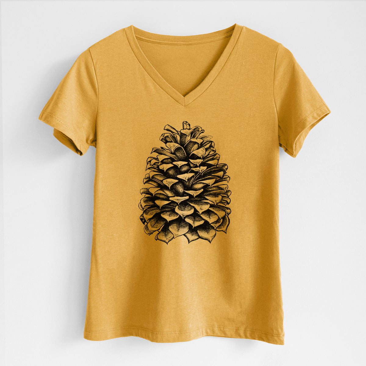 Honeycomb yellow women's relaxed fit cotton V-neck t-shirt laid flat, printed with a detailed black ink illustration of a large Jeffrey pine cone.