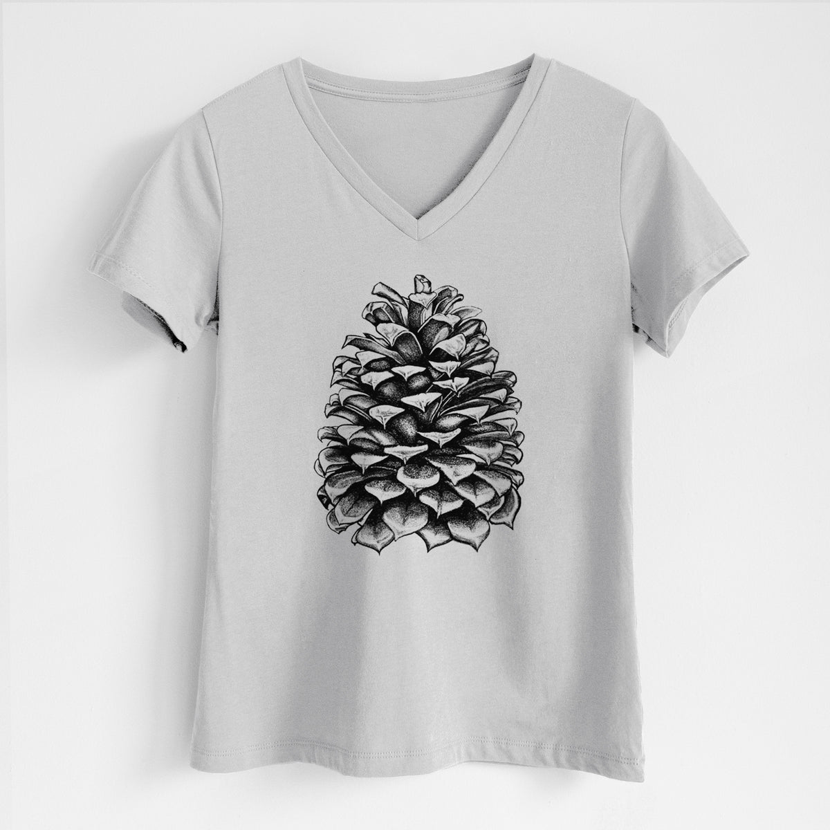 Lunar grey women's relaxed fit cotton V-neck t-shirt laid flat, printed with a detailed black ink illustration of a large Jeffrey pine cone.