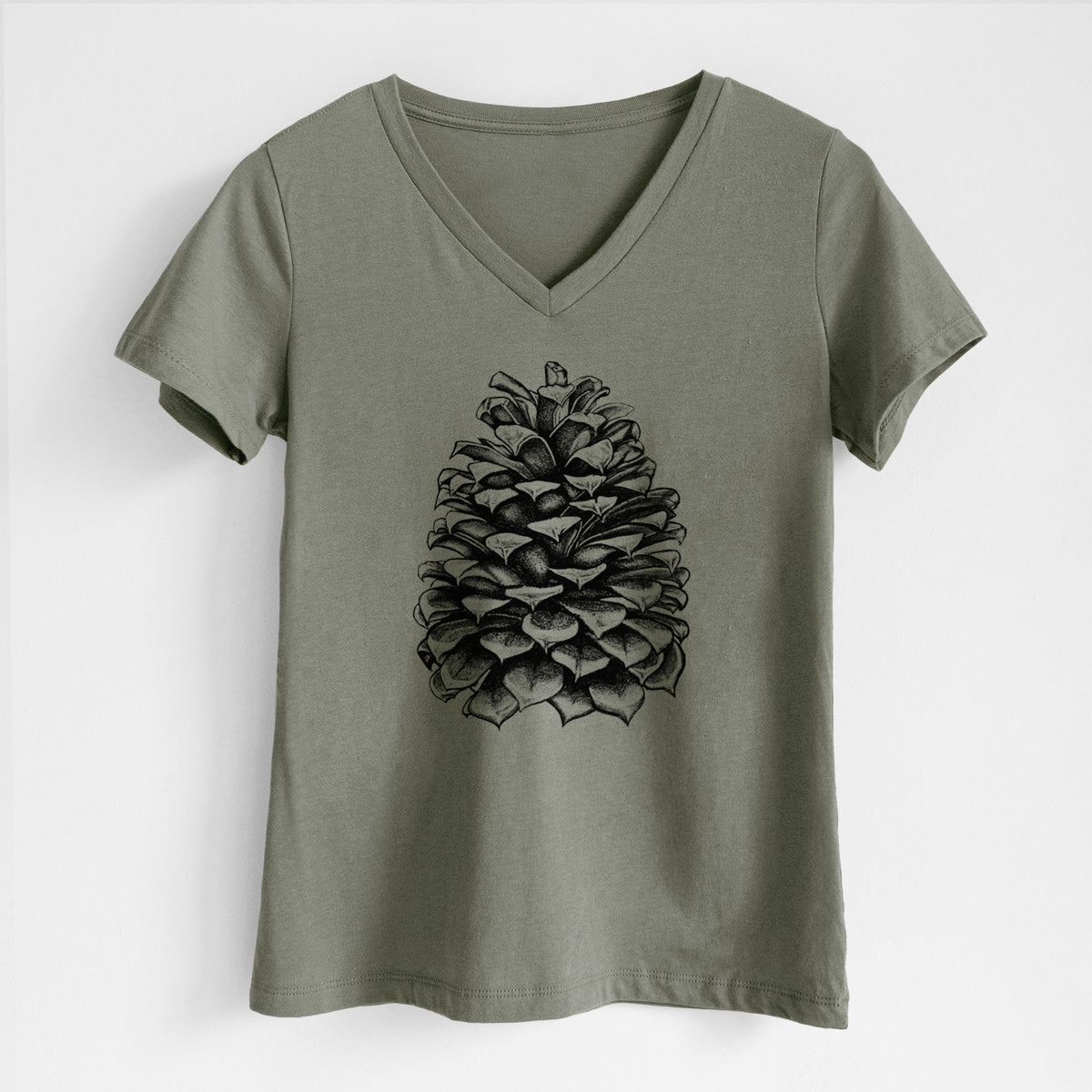 Military green women's relaxed fit cotton V-neck t-shirt laid flat, printed with a detailed black ink illustration of a large Jeffrey pine cone.