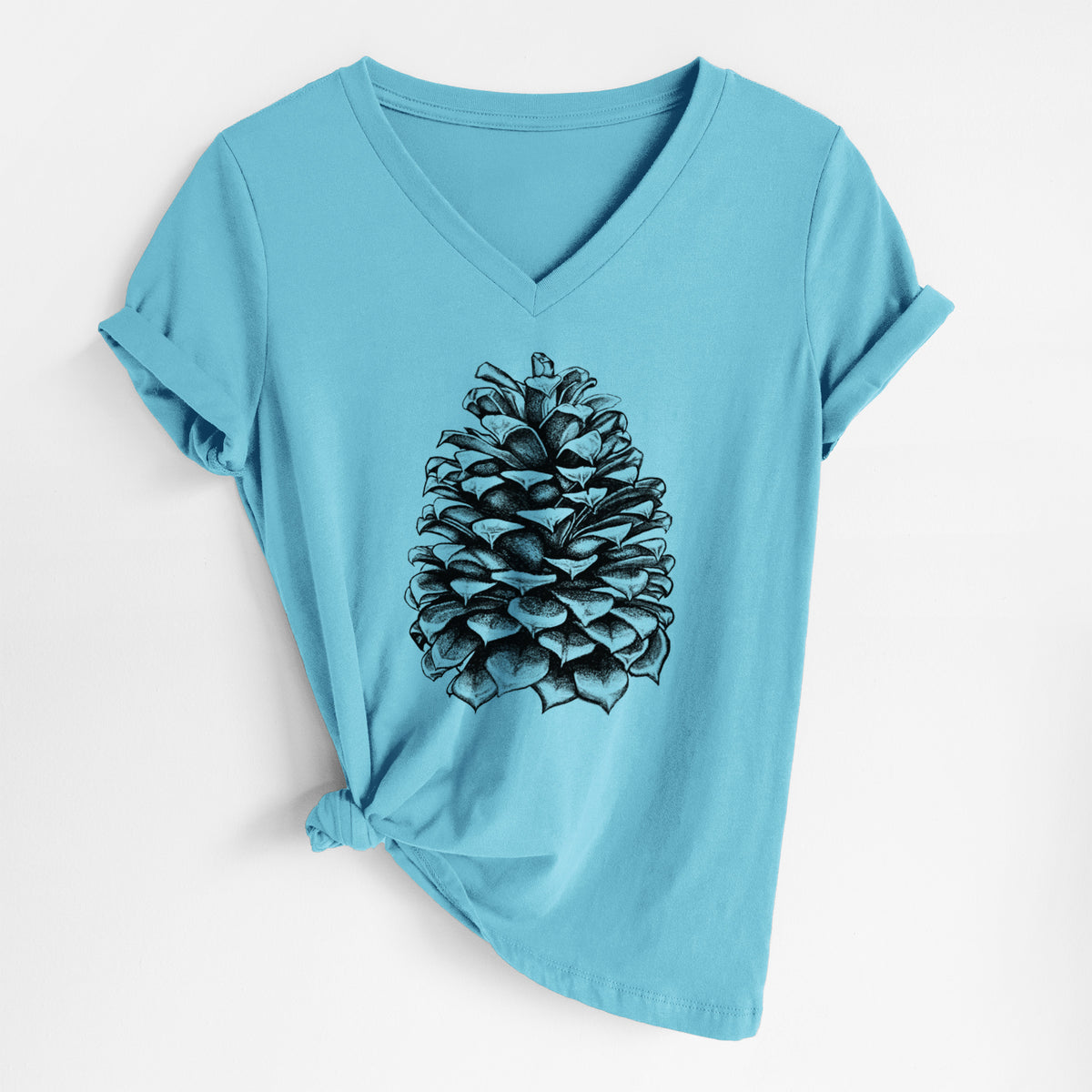 Turquoise women's relaxed fit cotton V-neck t-shirt laid flat, printed with a detailed black ink illustration of a large Jeffrey pine cone.