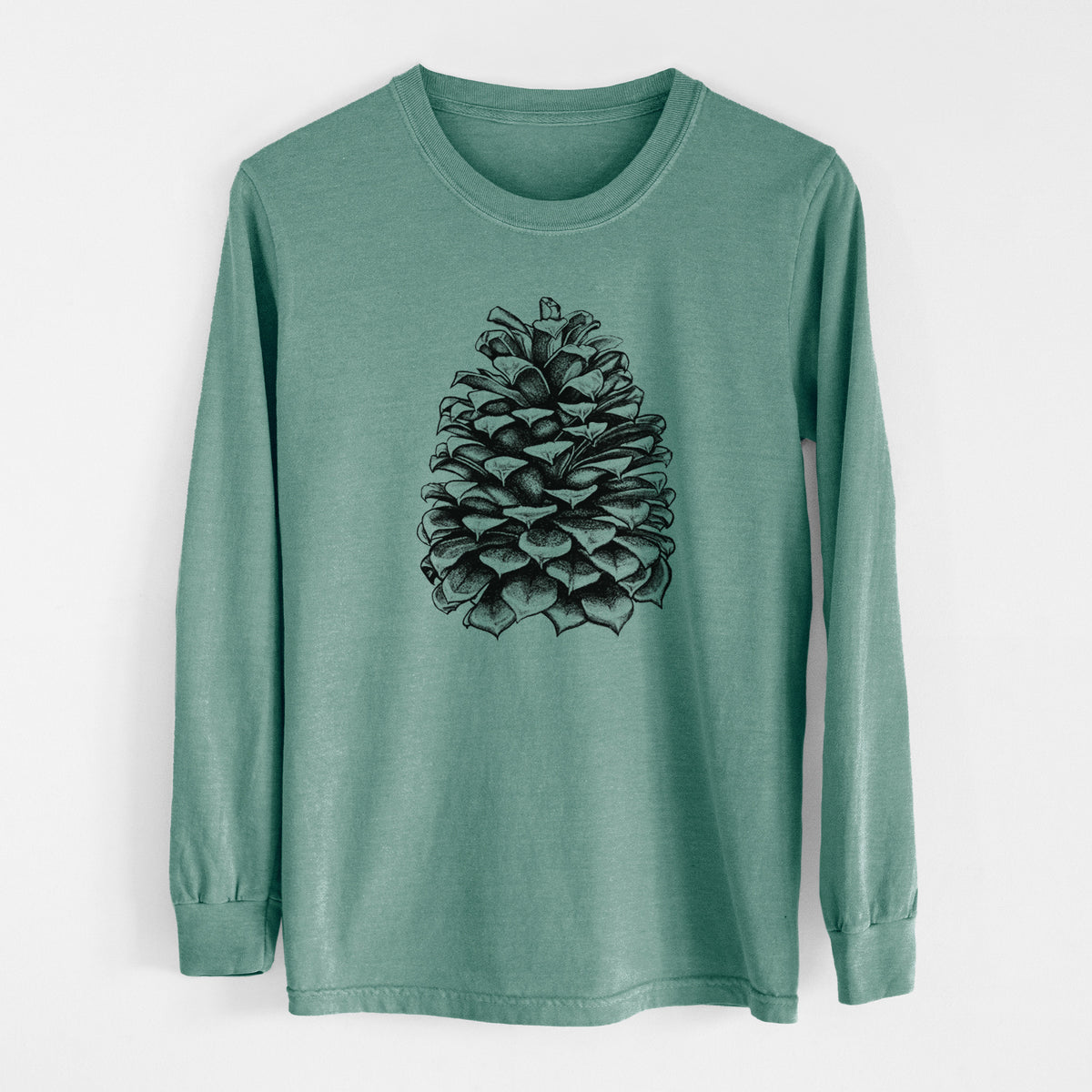 Pine green Comfort Colors long sleeve shirt laid flat, printed with a detailed black ink illustration of a large Jeffrey pine cone.