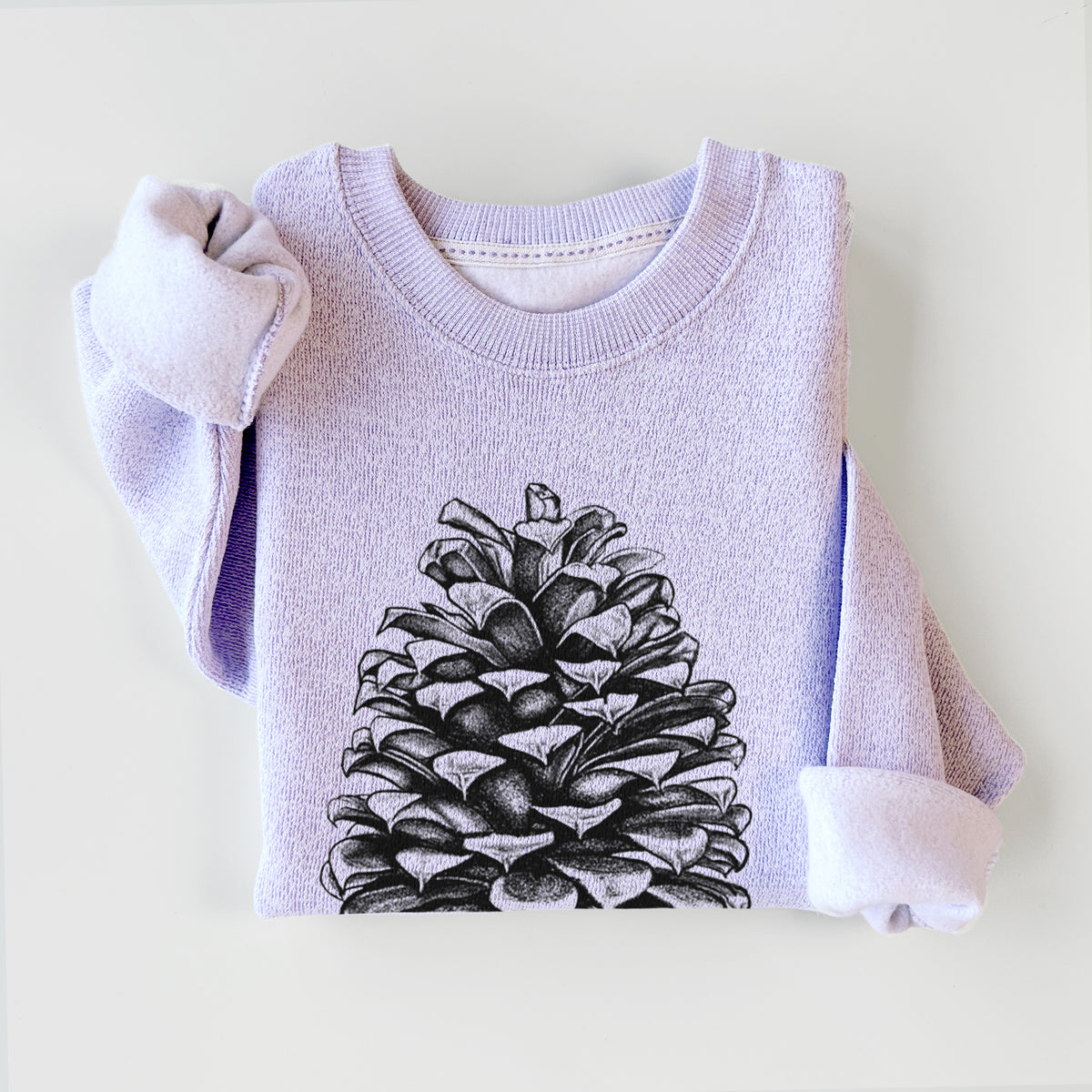 Ice purple knit sweatshirt printed with a detailed black ink illustration of a large Jeffrey pine cone, styled flat.