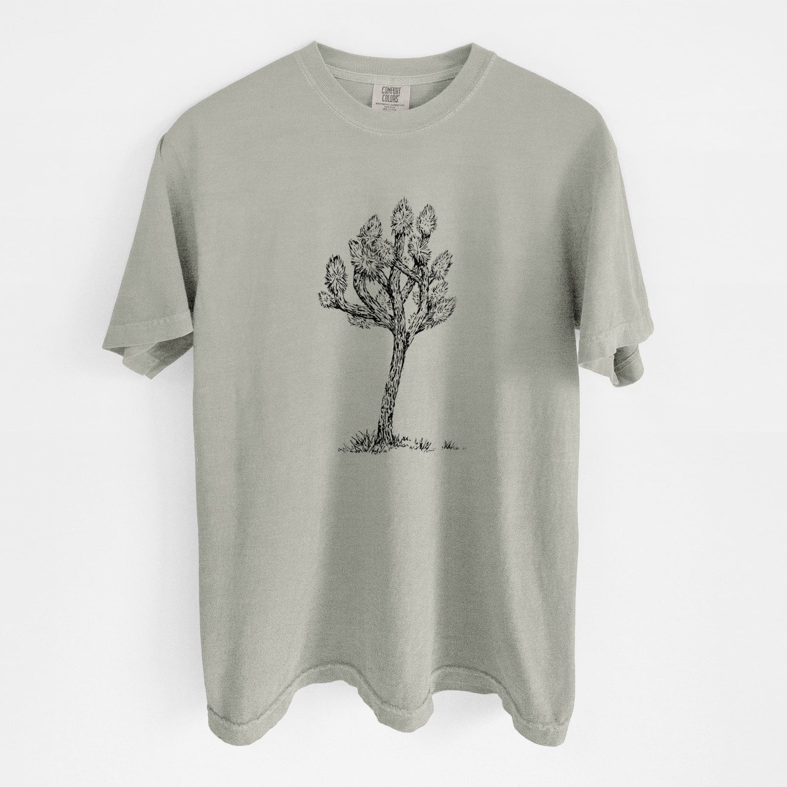 Blue jean Comfort Colors t-shirt laid flat, printed with a detailed black ink illustration of a Joshua tree.