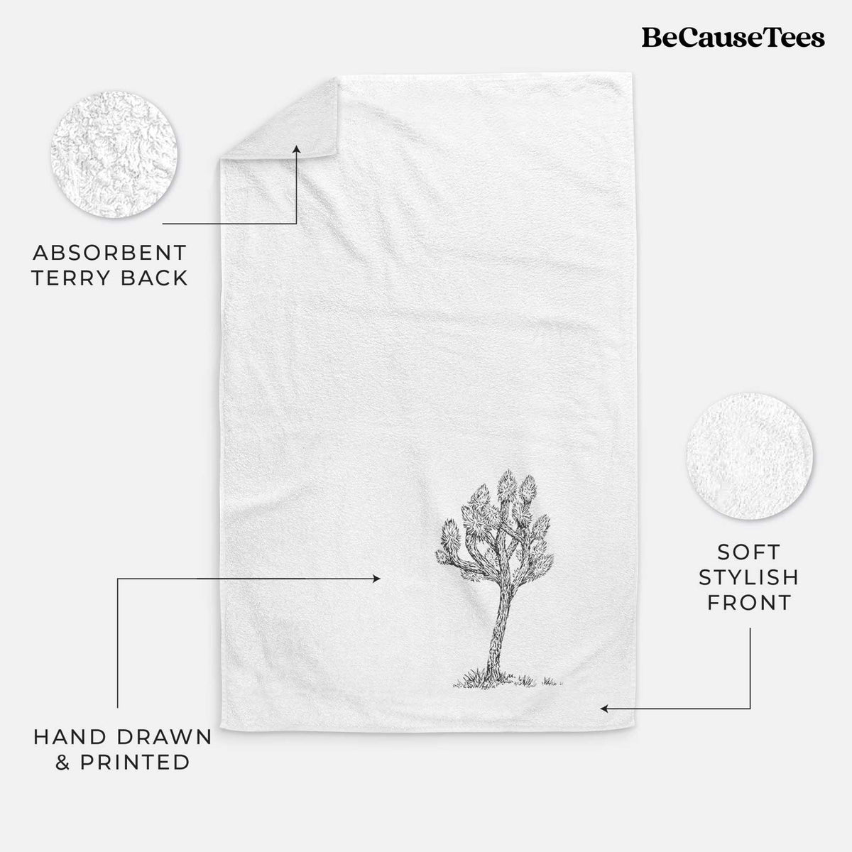 White hand towel printed with a detailed black ink illustration of a Joshua tree.