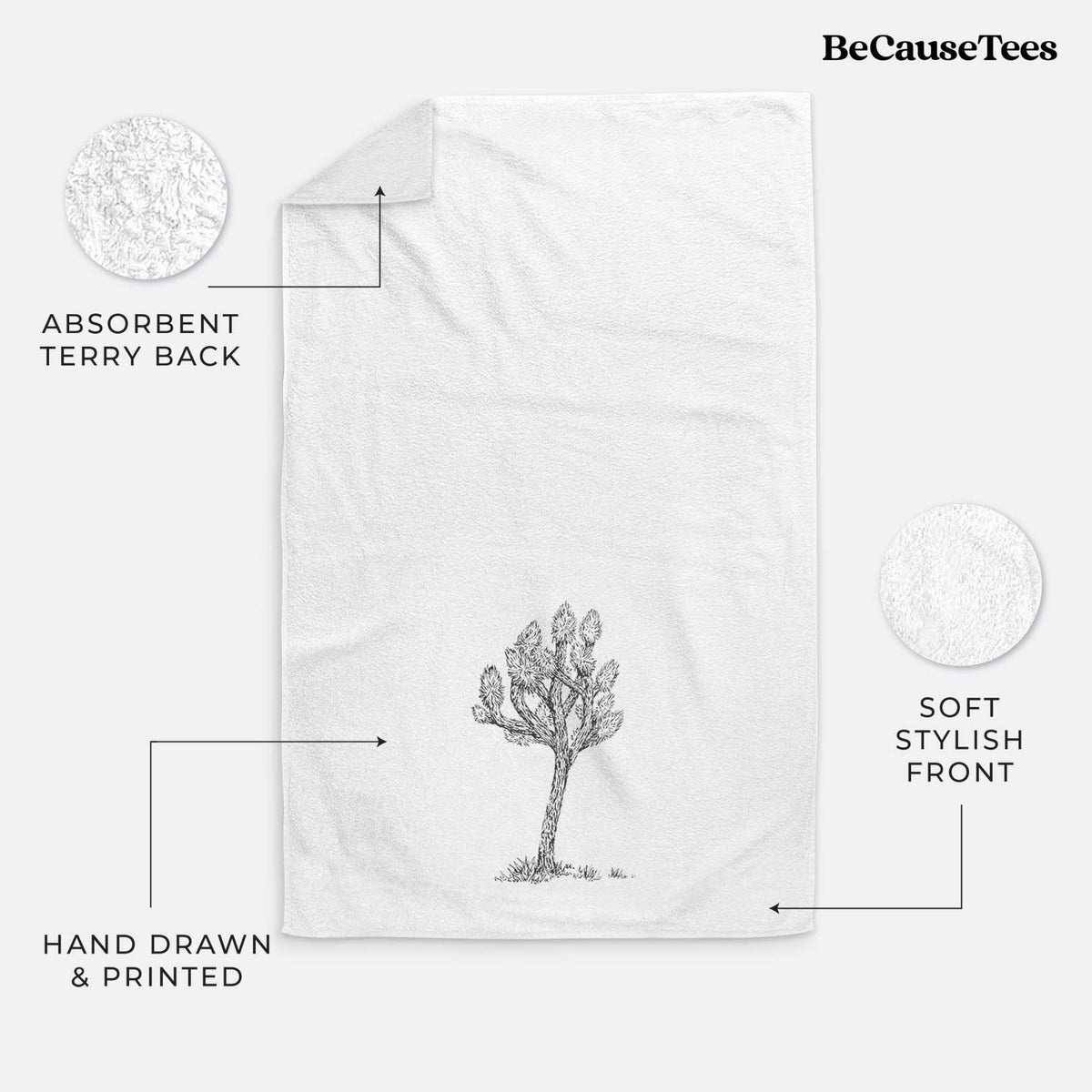 White hand towel printed with a detailed black ink illustration of a Joshua tree.