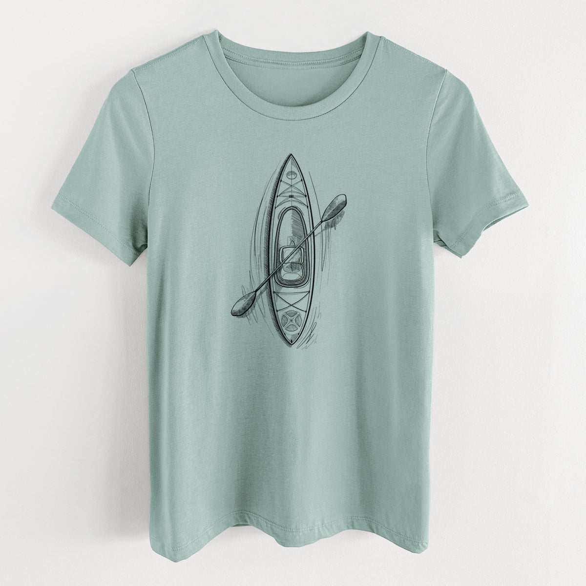 Dusty blue women's relaxed fit cotton t-shirt laid flat, printed with a black ink illustration of a kayak with a paddle, seen from above.