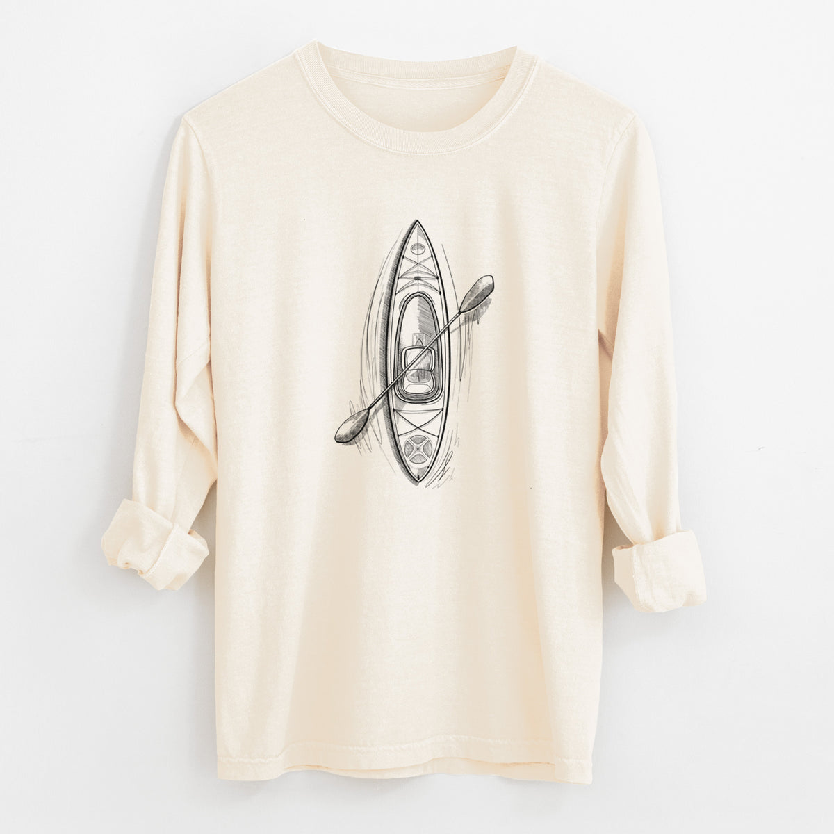 Ivory Comfort Colors long sleeve shirt laid flat with the cuffs rolled, printed with a black ink illustration of a kayak with a paddle, seen from above.