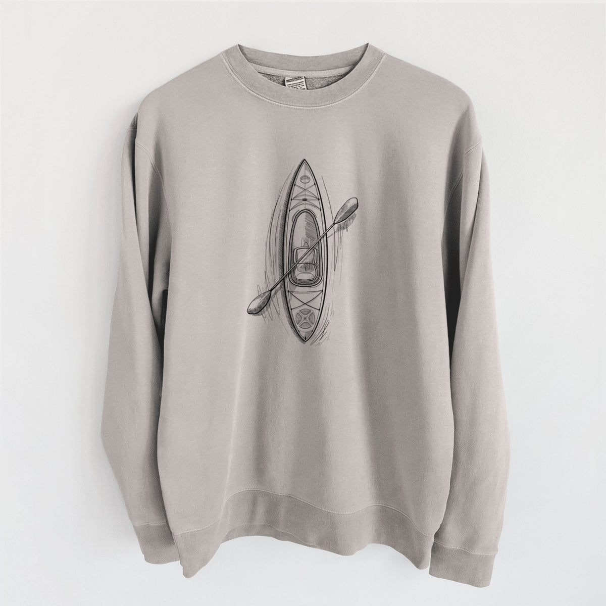 Cement grey pigment dyed crewneck sweatshirt laid flat, printed with a black ink illustration of a kayak with a paddle, seen from above.