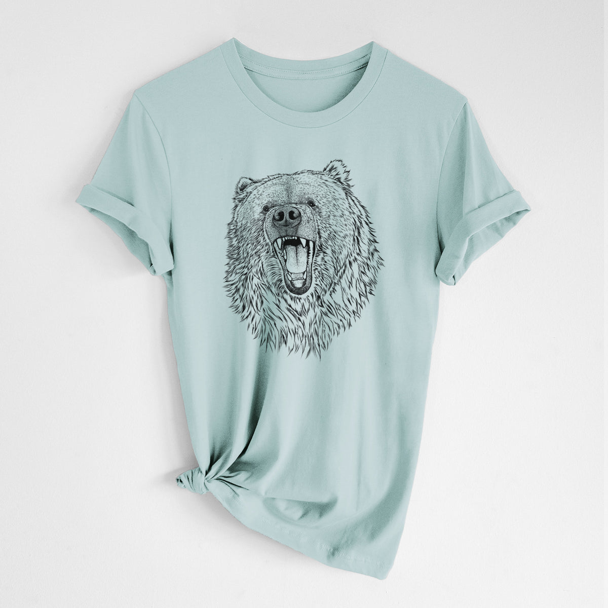 Dusty blue lightweight cotton t-shirt laid flat with the sleeves rolled, printed with a detailed black ink portrait of a roaring Kodiak bear facing forward.