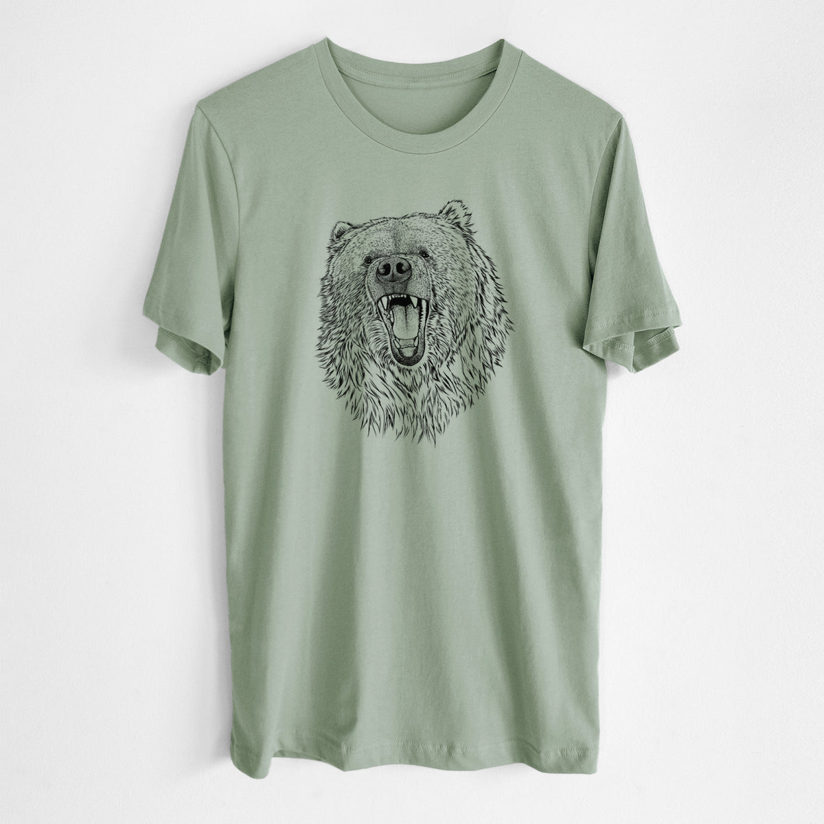 Sage green lightweight cotton t-shirt laid flat, printed with a detailed black ink portrait of a roaring Kodiak bear facing forward.