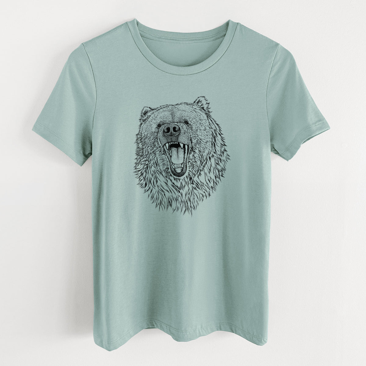 Dusty blue women's relaxed fit cotton t-shirt laid flat, printed with a detailed black ink portrait of a roaring Kodiak bear facing forward.