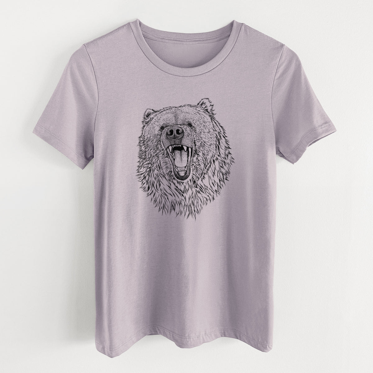 Light violet women's relaxed fit cotton t-shirt laid flat, printed with a detailed black ink portrait of a roaring Kodiak bear facing forward.