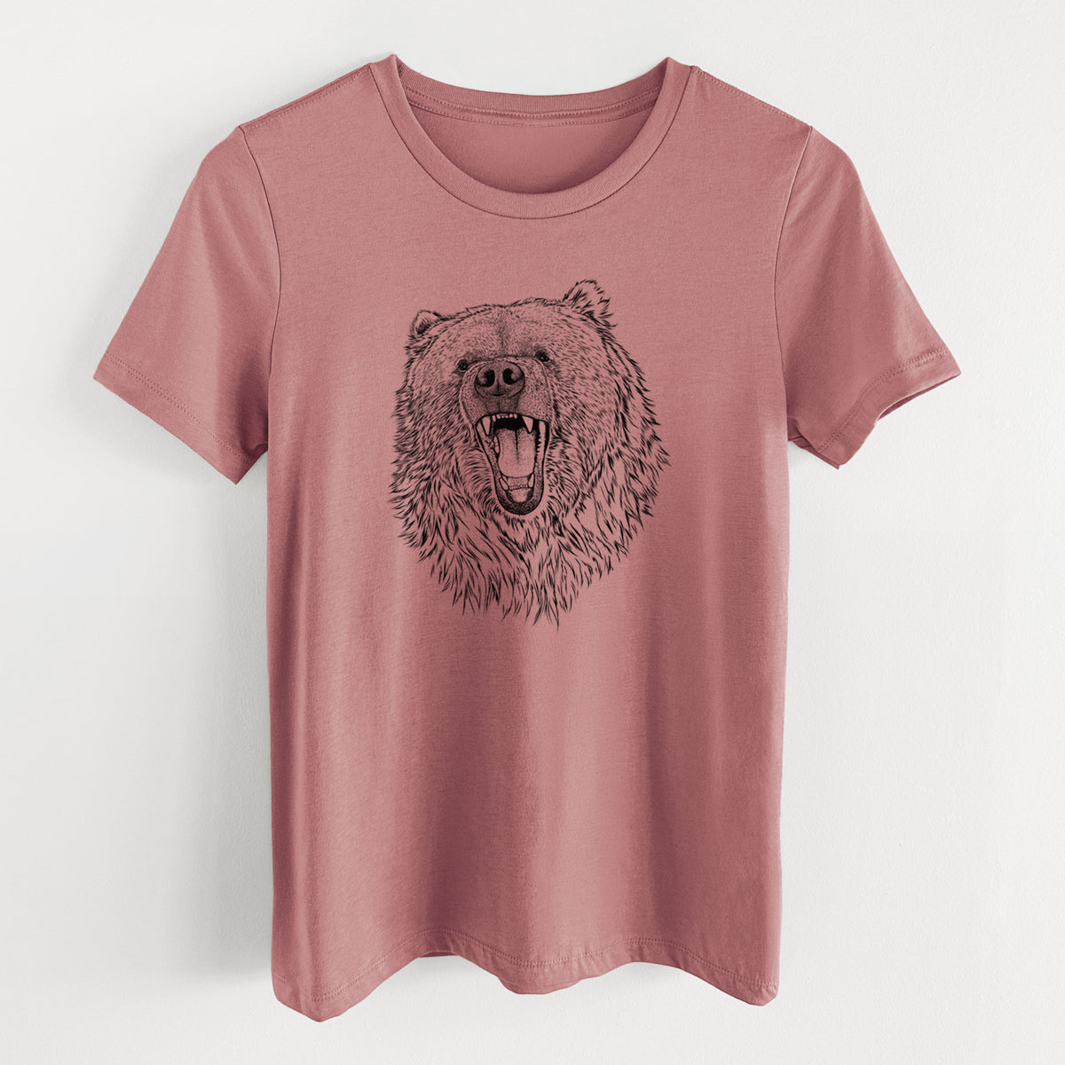 Mauve pink women's relaxed fit cotton t-shirt laid flat, printed with a detailed black ink portrait of a roaring Kodiak bear facing forward.