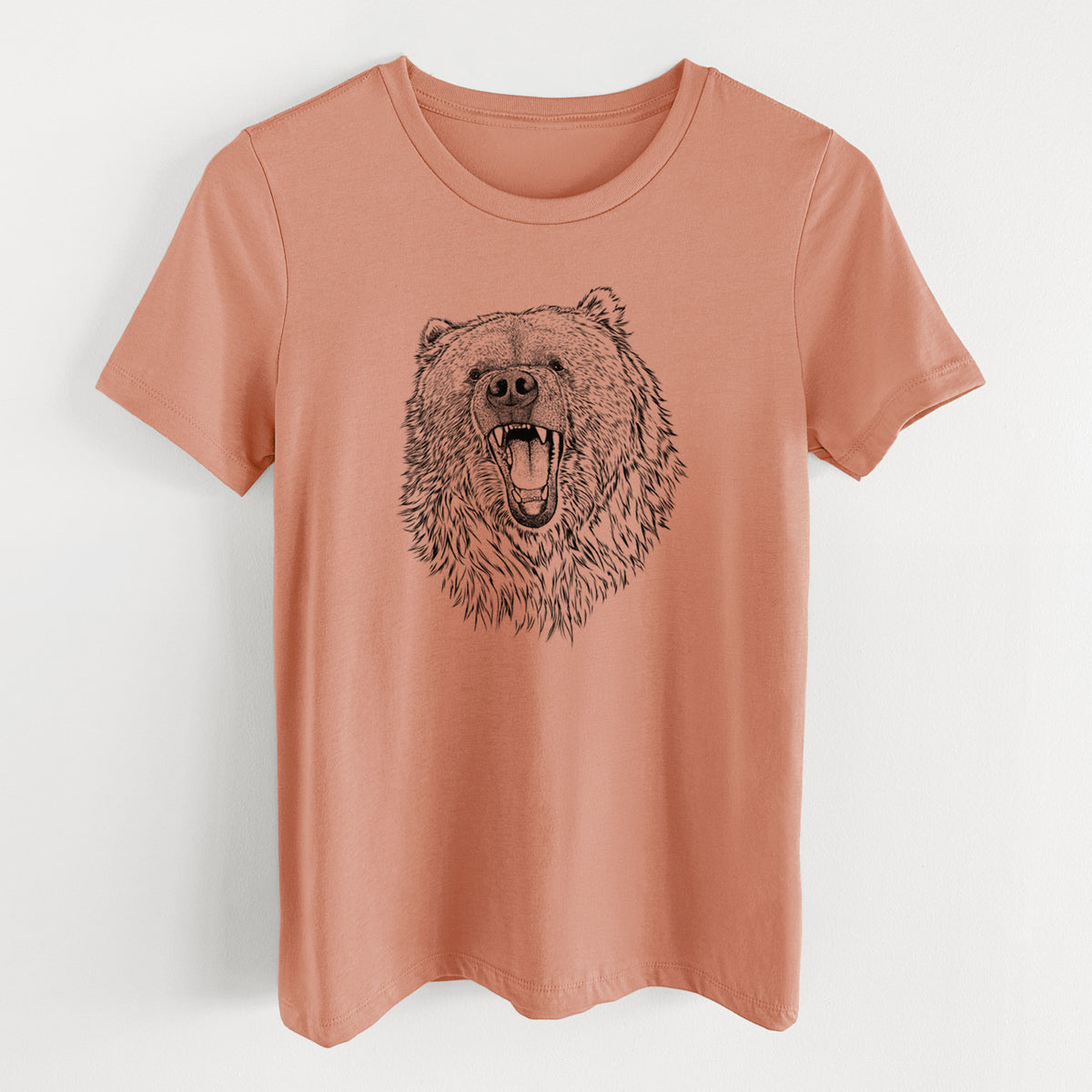 Terracotta orange women's relaxed fit cotton t-shirt laid flat, printed with a detailed black ink portrait of a roaring Kodiak bear facing forward.